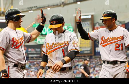 Baltimore Orioles' Brian Roberts congratulates Melvin Mora after Mora hit a  two-run homer, scoring Roberts, off Houston Astros pitcher Wandy Rodriguez  in the first inning Wednesday, June 15, 2005, in Baltimore.(AP Photo/Gail