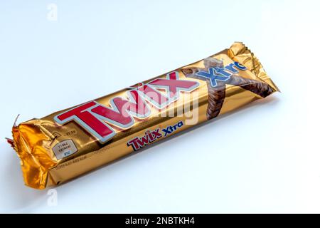 London. UK-02.12.2023. A packaged Twix chocolate bar isolated in white. Stock Photo