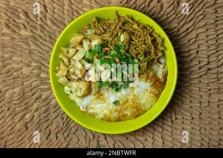 One bowl of chicken porridge (bubur ayam) it is Indonesia breakfast food Stock Photo