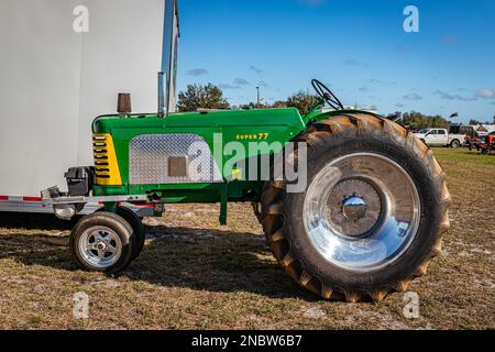 Fort Meade, FL - February 24, 2022: High perspective side view of a 1958 Oliver Super 77 Tractor at a local tractor show. Stock Photo