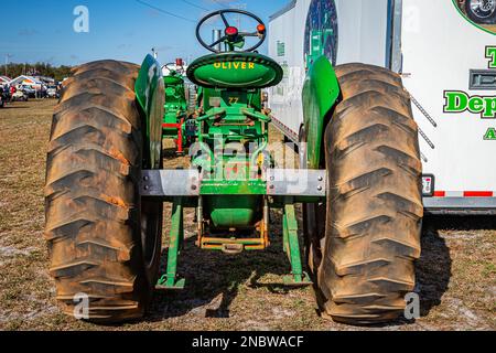 Fort Meade, FL - February 24, 2022: High perspective rear view of a 1958 Oliver Super 77 Tractor at a local tractor show. Stock Photo