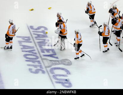 The Boston Bruins and Philadelphia Flyers shake hands at the end of the 2010  Bridgestone NHL Winter Classic at Fenway Park in Boston, Massachusetts on  New Years Day, January 1, 2010. The