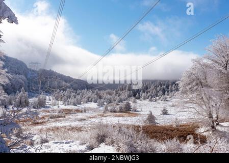 Electricity pylons in winter mountains in Bulgaria Stock Photo - Alamy