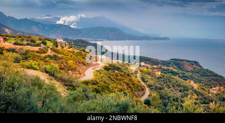 Dramatic Albanian landscape on the Adriatic shore with green forest and foggy mountains. Picturesque spring morning in Albania, Europe. Traveling conc Stock Photo