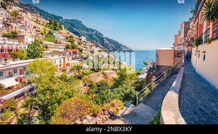 Charming summer cityscape of cliffside village on southern Italy's Amalfi Coast - Positano. Sunny morning seascape of Mediterranean sea. Traveling con Stock Photo