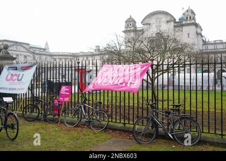 Cardiff University, Wales. February 14th 2023. A banner tied to railings outside Main Building.  Academics and senior professional services staff hold a strike rally in support of fair pay outside Cardiff University, Wales. February 14th 2023.  Credit Penallta Photographics / Alamy Live Stock Photo