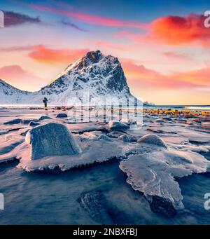 Photographer takes picture of Haukland Beach, Vastvagoy. Amazing  scene of Lofoten Island, Norway, Europe. Wonderful seascape of Norwegian sea. Beauty Stock Photo
