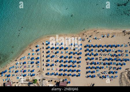 Umbrellas on Fig Tree beach in Protaras resort in Famagusta District, Cyprus island country Stock Photo