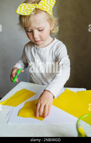 Preschool scissor activities for preschool kids to cut the paper with  scissors to improve motor skills, coordination and develop small muscles  for kin Stock Photo - Alamy