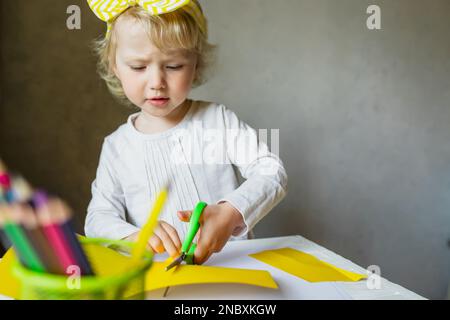 Preschool scissor activities for preschool kids to cut the paper with  scissors to improve motor skills, coordination and develop small muscles  for kin Stock Photo - Alamy