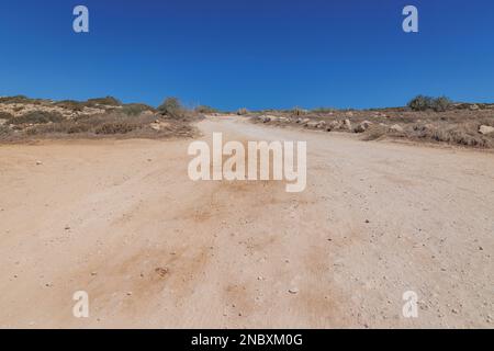 Dust road to Sea Caves area in Cape Greco National Forest Park in Cyprus Stock Photo