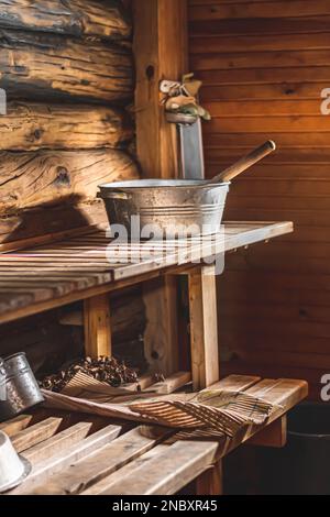 Old traditional wooden sauna in the village of Margionys, Dzūkija or Dainava region, Lithuania, vertical Stock Photo