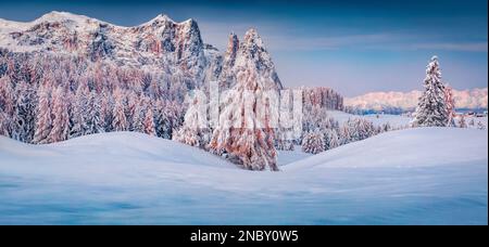 Panoramic morning view of Alpe di Siusi village. Colorful winter sunrise in Dolomite Alps. Unbelievable landscape of Italian ski resort. Beauty of nat Stock Photo