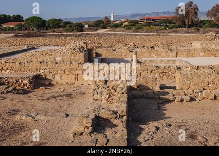 Ruins in Paphos Archaeological Park in Paphos city, Cyprus island country, view with Lighthouse Stock Photo