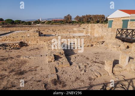 Ruins in Paphos Archaeological Park in Paphos city, Cyprus island country, view with Lighthouse Stock Photo