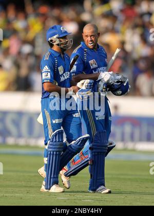 Mumbai Indians Batsmen Rohit Sharma, Left, And Andrew Symonds Adjust 