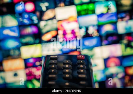 Video on demand (VoD) screen with remote control in foreground Stock Photo
