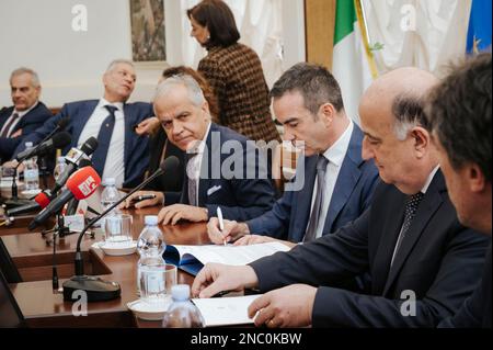 Catanzaro, Italy. 13th Feb, 2023. Roberto Occhiuto (C-R), Regional Governor, seen signing the protocol. The Italian Minister of Interior Matteo Piantedosi attended the inauguration of the operative Anti-mafia Investigation Department (DIA - Direzione Investigativa Antimafia) The Minister also attended the provincial meeting for order and public security and the signature for a protocol for re-usage of buildings and assets seized from organise crime. Credit: SOPA Images Limited/Alamy Live News Stock Photo