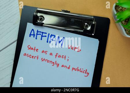 Definition of Affirm word with a meaning on a paperwork. Dictionary concept Stock Photo