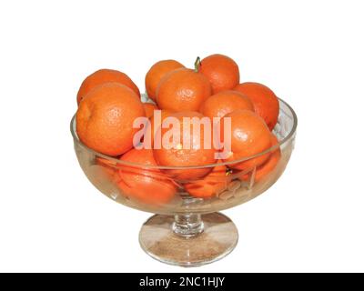 Clementines in a glass bowl. Group of clementines isolated on white Stock Photo