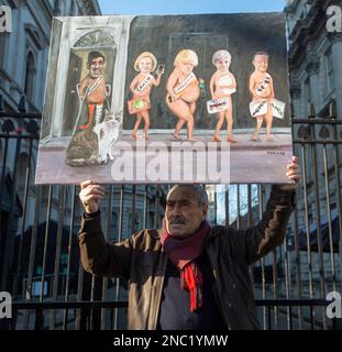 London, England, UK. 14th Feb, 2023. British artist KAYA MAR poses with his latest painting depicting UK Prime Minister's office's cat Larry with 5 prime ministers he survived to celebrate his 12th year in Downing Street. Larry arrived at 10 Downing Street on 15th February 2011. (Credit Image: © Tayfun Salci/ZUMA Press Wire) EDITORIAL USAGE ONLY! Not for Commercial USAGE! Stock Photo