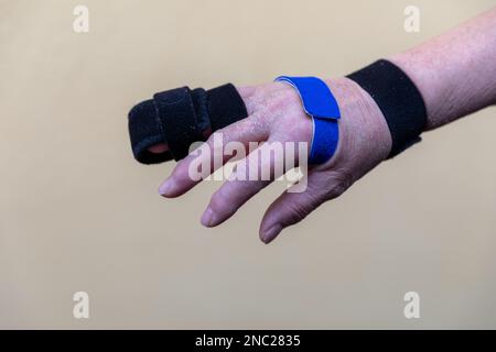 Loop Splint Hand two sided finger splint with two hook and loop straps on a broken ...