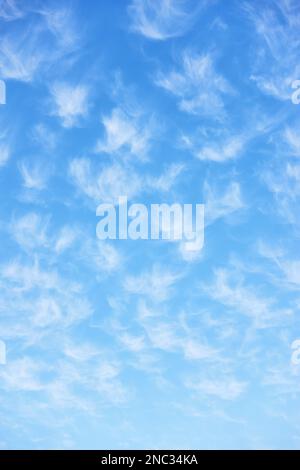 Beautiful spring sky with lots small clouds. Vertical background Stock Photo