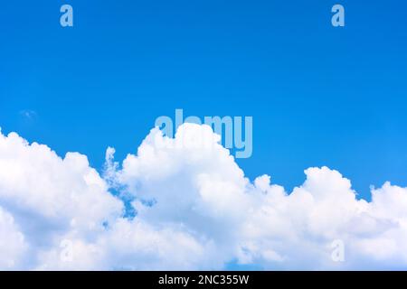 Blue sky with white cumulus clouds. Background with large space for your own text Stock Photo