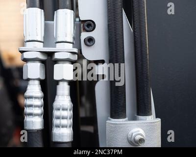 closeup of hydraulic hoses on a fork lift truck and hose connectors Stock Photo