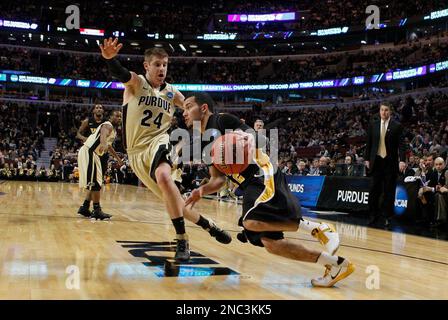 Purdue guard Ryne Smith (24) congratulates teammate Lewis Jackson, right,  during the second half against St. Peter's in the second round of the 2011  NCAA Men's Basketball Championship at the United Center