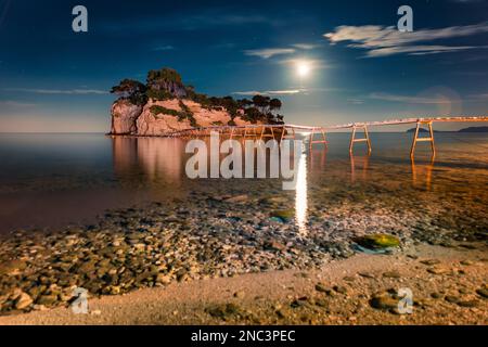 Extraordinary night view of Cameo Island with moon in the sky. Wonderful summer scene of Port Sostis, Zakynthos island, Greece, Europe.Traveling conce Stock Photo