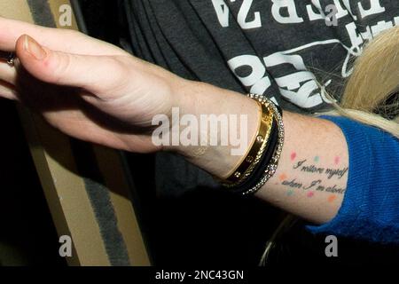 A tattoo is seen on Baltimore Orioles' Robert Andino's arm before a  baseball game against the New York Yankees in Baltimore, Monday, April 9,  2012. (AP Photo/Patrick Semansky Stock Photo - Alamy