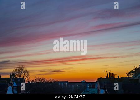 Northampton, UK. Weather, 14th Februry  2023. A nice sunset over the rooftops after a very misty start to the day. Credit: Keith J Smith./Alamy Live News Stock Photo