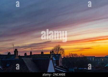 Northampton, UK. Weather, 14th Februry  2023. A nice sunset over the rooftops after a very misty start to the day. Credit: Keith J Smith./Alamy Live News Stock Photo