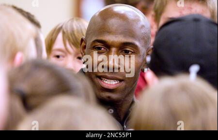 John Ehlke  The West Bend Daily News Green Bay Packer's wide receiver Donald  Driver signs a jersey at the YMCA Sports Night fundraiser at the West Bend  Mutual Prairie Friday night.