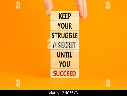 Keep secret symbol. Concept words Keep your struggle a secret until you succeed on wooden blocks. Beautiful orange background. Copy space. Businessman Stock Photo