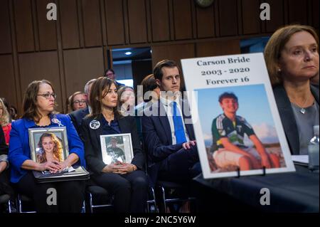 Christine McComas, left, holds a photo of her daughter Grace McComas, who took her own life on Easter Sunday, 2012. She was the victim of online bullying, while seated next to Rose Bronstein, second from left, who holds a photo of her son Nate Bronstein, who was cyberbullied and suicide baited over Snapchat and text messages by classmates, join Kristin Bride, Survivor Parent and Social Media Reform Advocate, right, who sits next to a photo of her 16-year-old son Carson Bride as she appears before a Senate Committee on the Judiciary hearing to examine protecting our children online, in the Hart Stock Photo