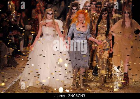 British designer Vivienne Westwood, center, appears with a