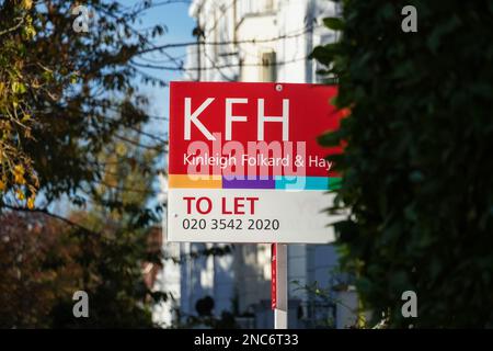 Real estate sign To Let outside terraced houses in Kensington London, England United Kingdom UK Stock Photo