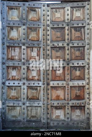 closed old wooden tall door gate Stock Photo