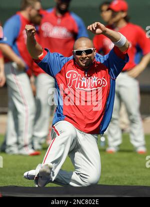 Philadelphia Phillies' Shane Victorino slides into home to score