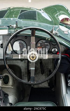 Steering wheel & dashboard of a rare British-built 1952 Jaguar C-Type former racing sports car in the Colorado Grand road rally. Stock Photo