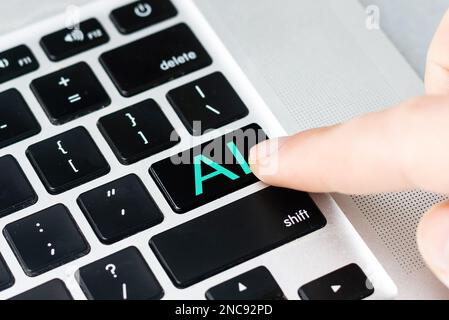 hand pressing a keyboard on a laptop Robotic AI Stock Photo