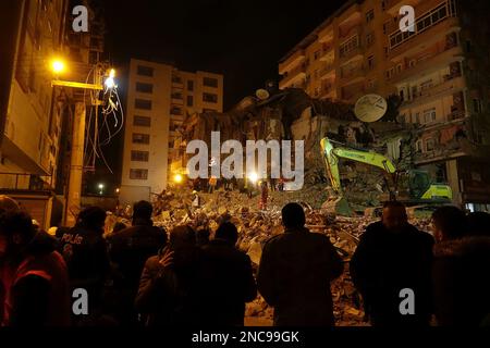 Diyarbakir, Turkey. 9th Feb, 2023. Relatives of those still trapped under the rubble watch hopefully as the search and rescue teams dig through the rubble in search of bodies and survivors at the earthquake zone 7 buildings in the city were completely destroyed. Rescue work in the city was completed 9 days after the earthquake. The death toll reached 344. There are close to 1000 injured.There are a total of 307 buildings in Diyarbakir, 26 of which are destroyed, 25 need to be demolished immediately and 261 are heavily damaged. About 250,000 people cannot enter their homes. They either live Stock Photo