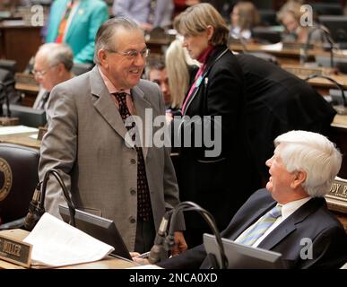 Louisville Democrats House Speaker Pro Tem Larry Clark, left, and Rep.  Charles Miller talk on the House floor during the legislative session in  Frankfort, Ky., Wednesday, March 16, 2011. (AP Photo Stock