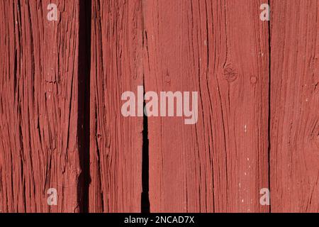 Red background from a wooden board old rustic fence or a wall Stock Photo