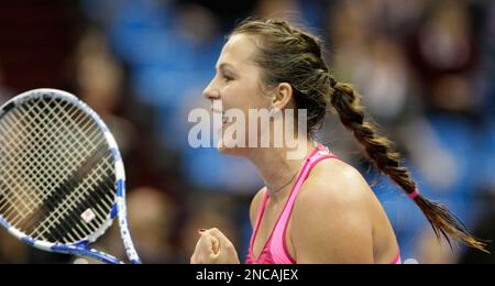 Anastasia Pavlyuchenkova of Russia reacts after losing the first set to  Serena Williams, USA, during their quarter-finals match at the . Open  held at the National Tennis Center on September 8, 2011