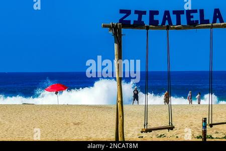 Puerto Escondido Oaxaca Mexico 26. January 2023 Romantic paradise swing on the beach in Zicatela Puerto Escondido Oaxaca Mexico. Stock Photo