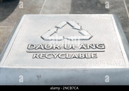 Recyclable text sign symbol on trash bin Stock Photo