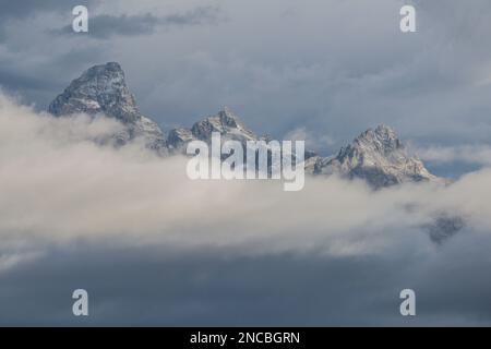 Teton peaks rise above a storm, depicting concepts of hope, faith and patience, Jackson, Wyoming, Grand Teton National Park, USA Stock Photo